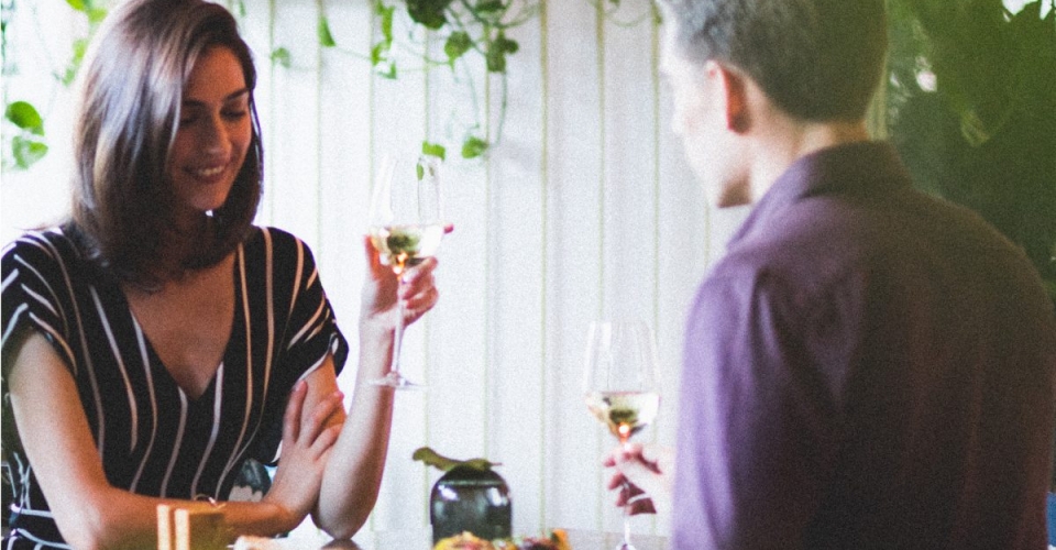 man and woman eating together
