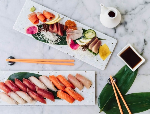 2 plates of sushi and sashimi.