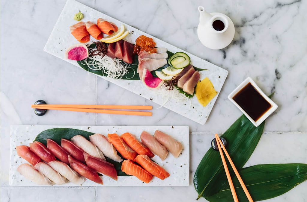 2 plates of sushi and sashimi.