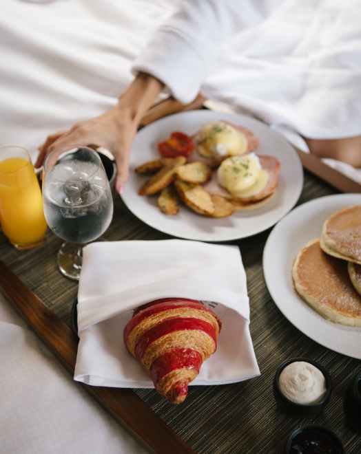 A spread of in-room dining dishes at Fairmont Pacific Rim