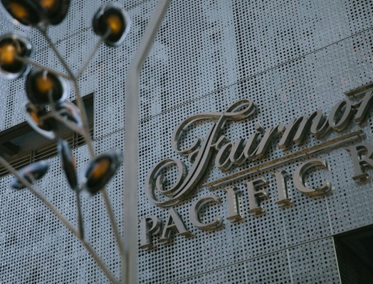 The Fairmont Pacific Rim logo on the hotel.