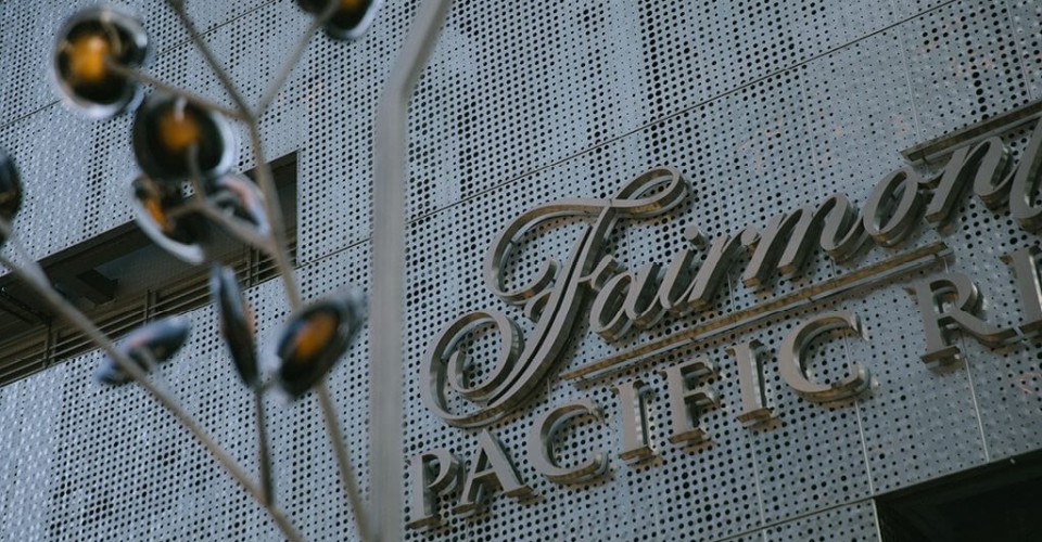 The Fairmont Pacific Rim logo on the hotel.