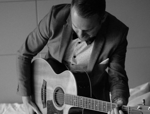 Paul Filek playing guitar