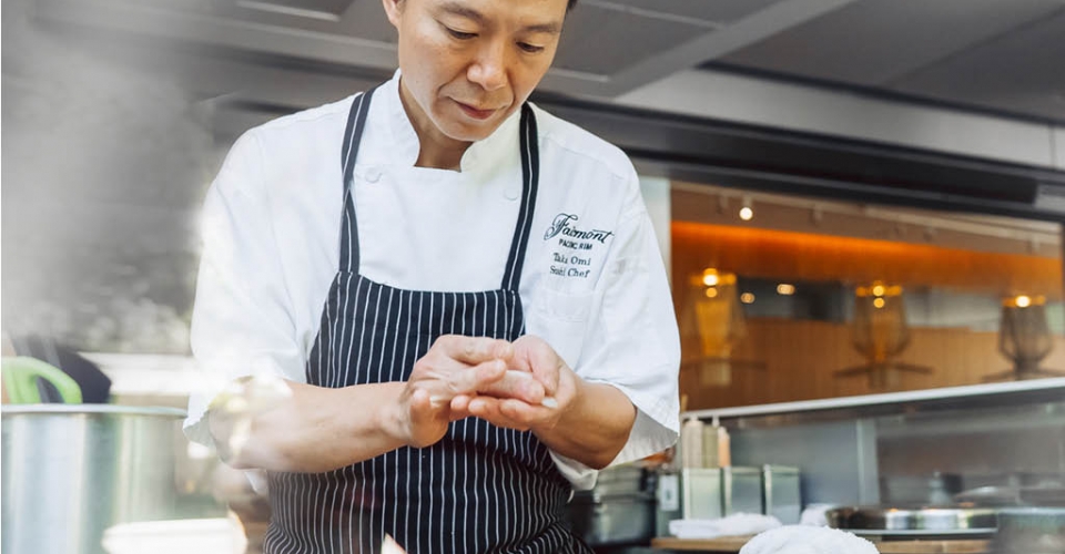 sushi chef preparing sushi at Fairmont Pacific Rim