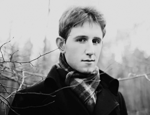 A black and white image of Austin Nash Park by a tree branch