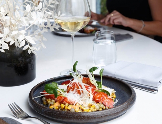 A plate of food on a set table