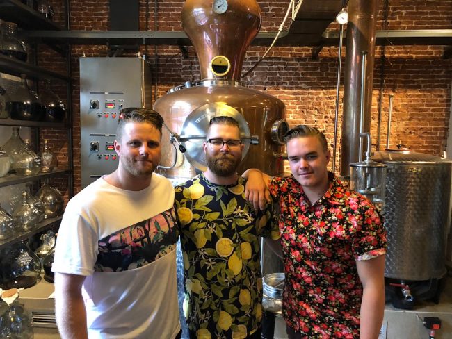 Three men in tropical shirts