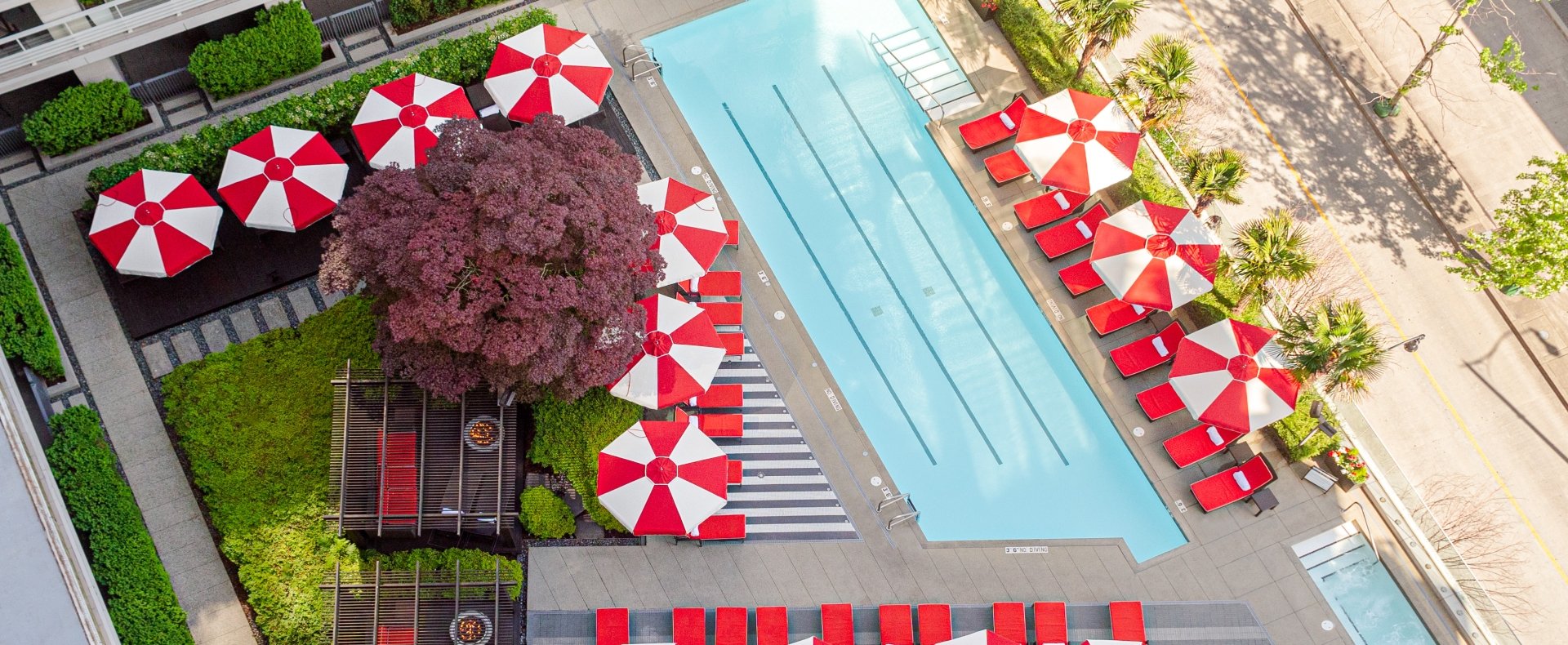 A view of the rooftop pool and cabana in a downtown Vancouver luxury hotel