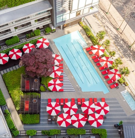 A view of the rooftop pool and cabana in a downtown Vancouver luxury hotel