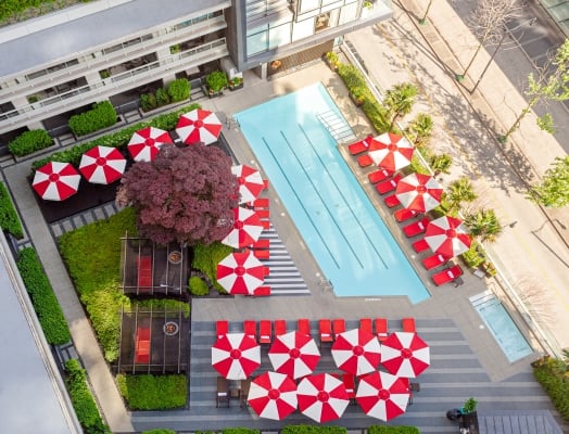 A view of the rooftop pool and cabana in a downtown Vancouver luxury hotel