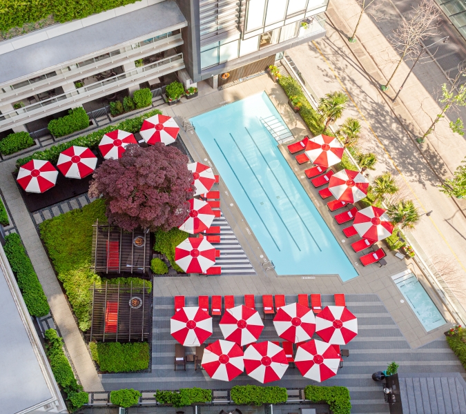 A view of the rooftop pool and cabana in a downtown Vancouver luxury hotel