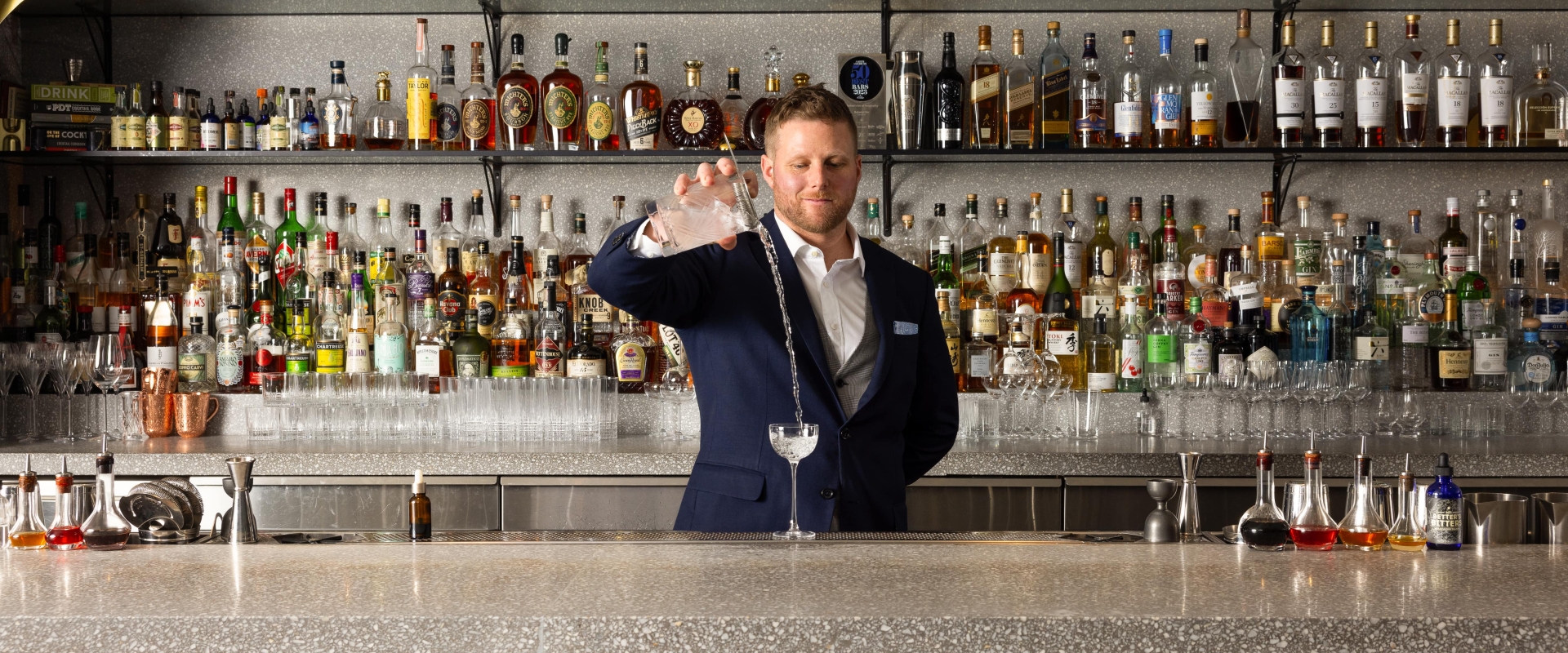 Grant Sceney pouring a drink at Botanist Bar in downtown Vancouver