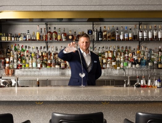 Grant Sceney pouring a drink at Botanist Bar in downtown Vancouver