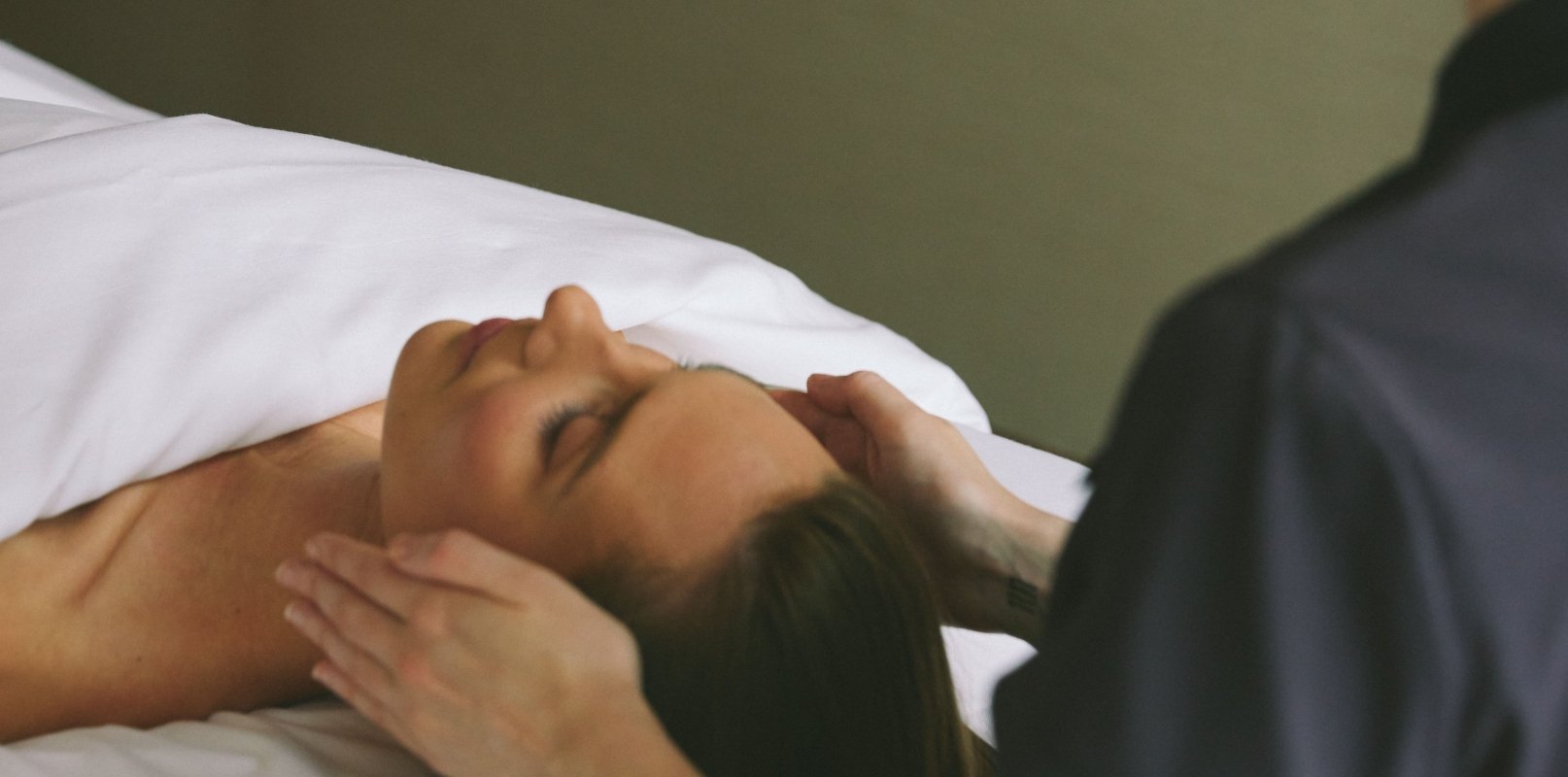 Woman getting facial massage at Fairmont Spa in downtown Vancouver