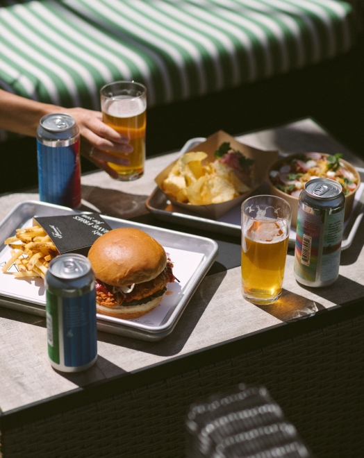 Outdoor dining with burgers and beers
