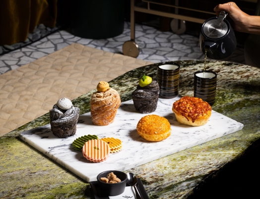 Six Asian-inspired pastries on top of a marble slate