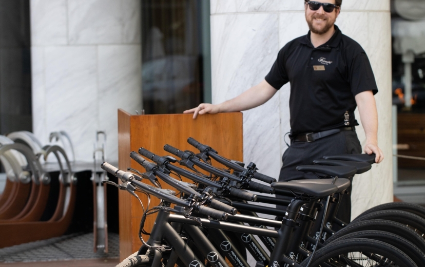 A bike butler at Fairmont Pacific Rim showing the e-bikes at the hotel in Vancouver