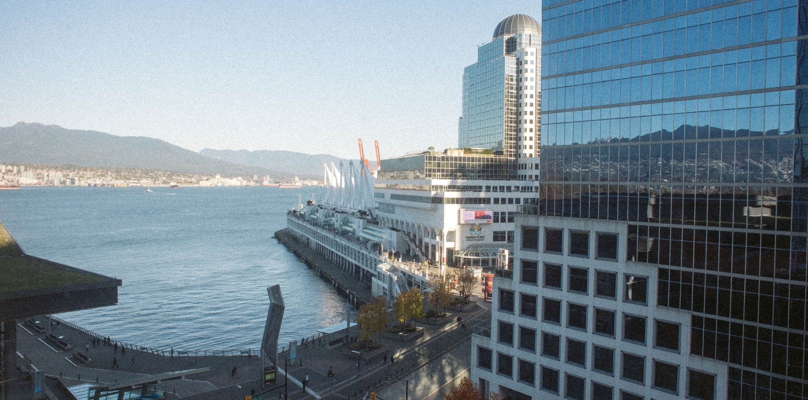 Hotel view of North Shore mountains and Canada Place