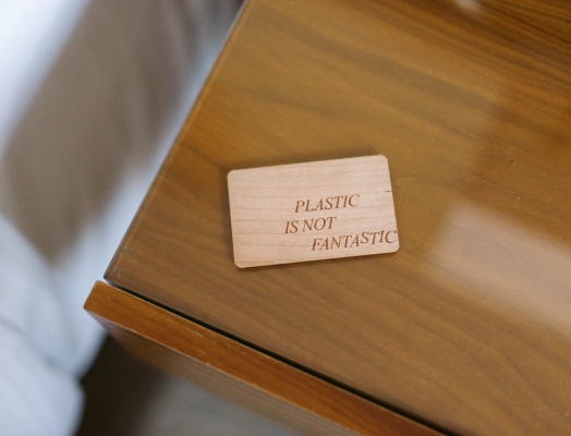 Wooden check-in key on top of a desk