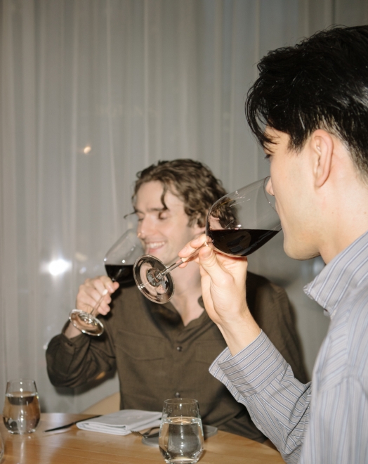 Two guys drinking wine at Botanist