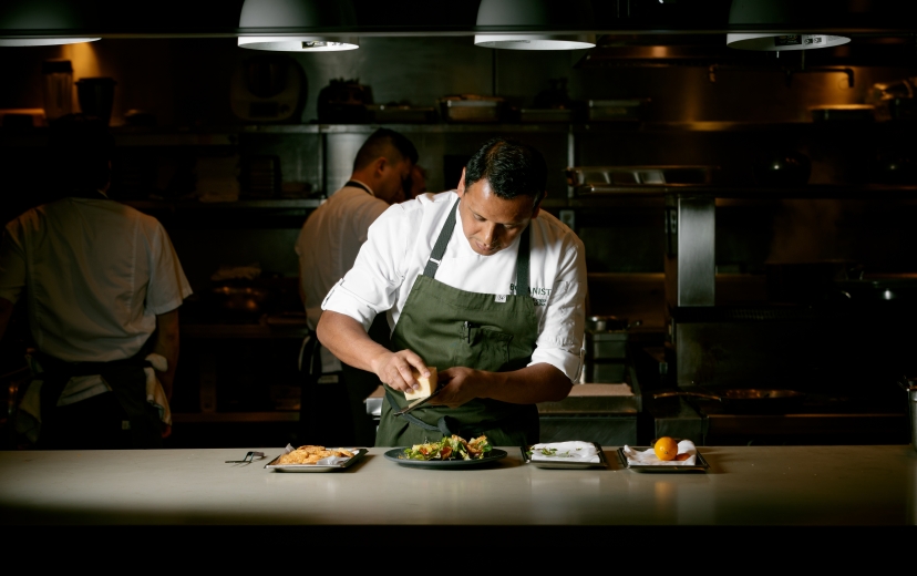Chef Hector Laguna plating a dish at Botanist