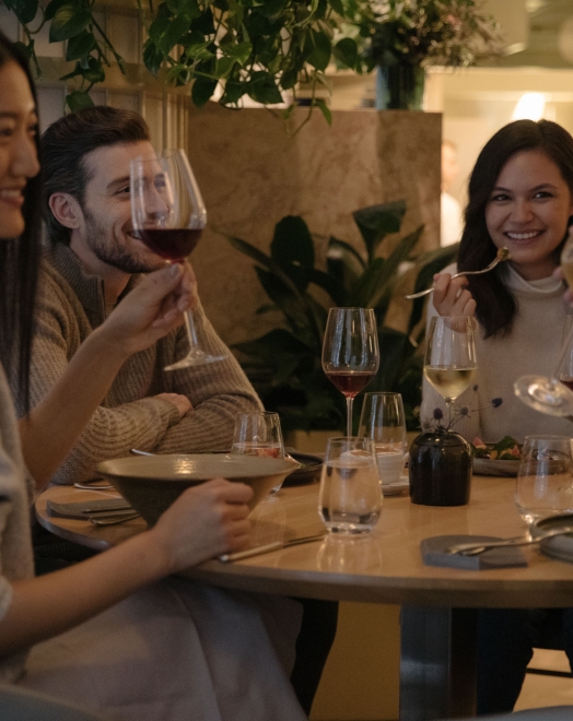 People celebrating Christmas at Botanist at Fairmont Pacific Rim
