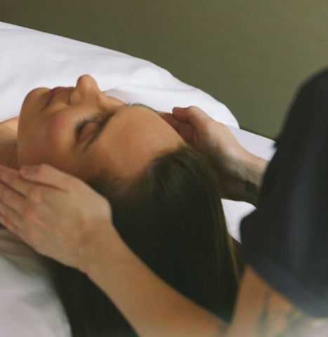 Woman receiving a facial treatment at a luxury spa in Vancouver