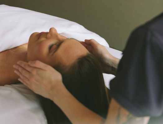 Woman receiving a facial treatment at a luxury spa in Vancouver
