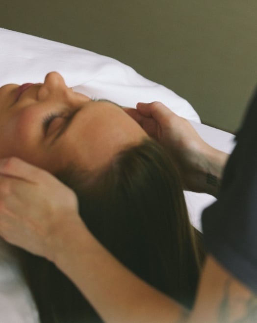 Woman receiving a facial treatment at a luxury spa in Vancouver