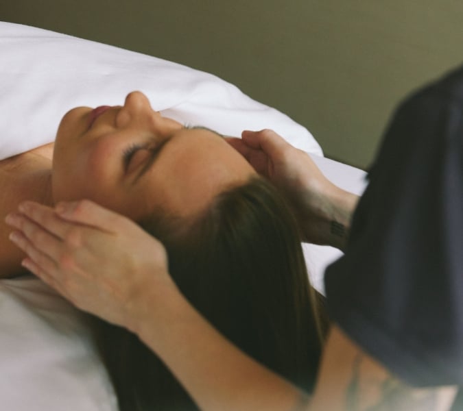 Woman receiving a facial treatment at a luxury spa in Vancouver