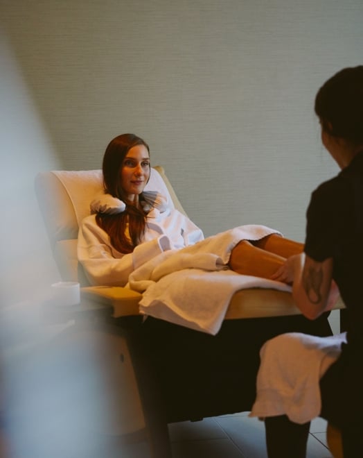 Woman receiving foot spa treatment at a luxury spa in Vancouver