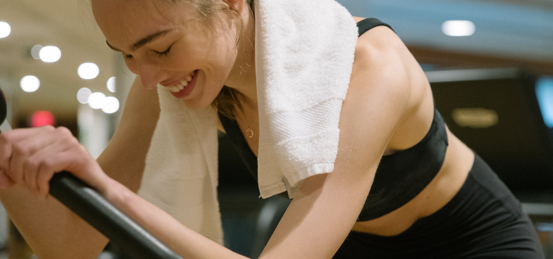Woman at bike machine at Fairmont Pacific Rim