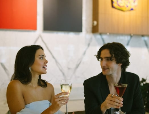 Two people having a glass of bubbles at The Lobby Lounge in Vancouver