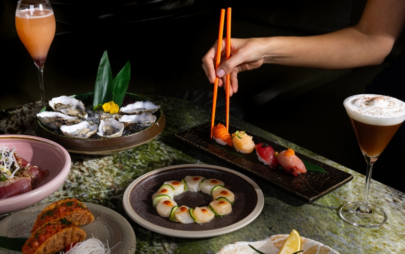 A table of Asian shareable dishes and sushi on downtown Vancouver