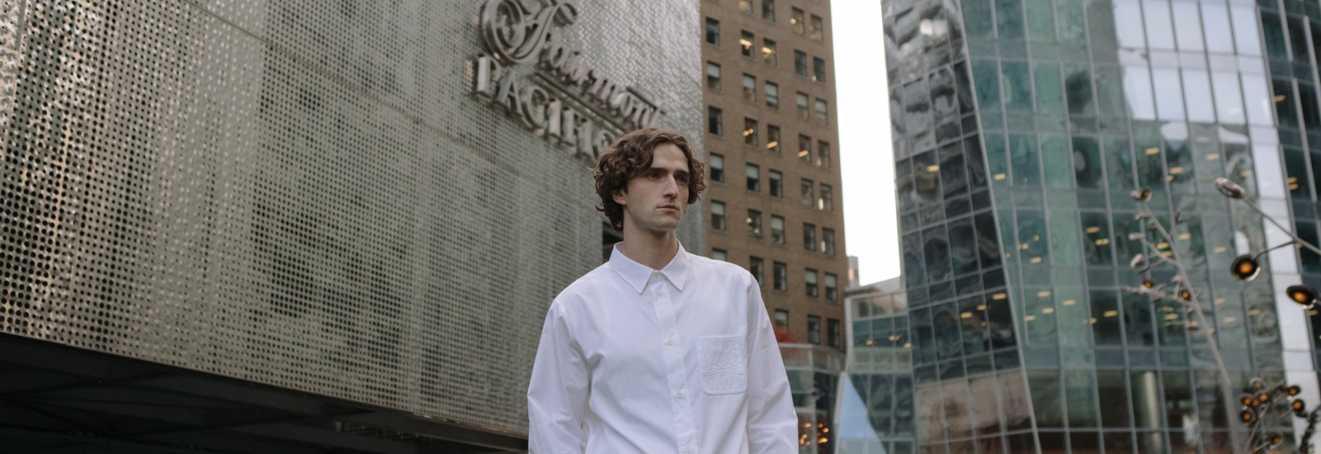 Man in front of Fairmont Pacific Rim