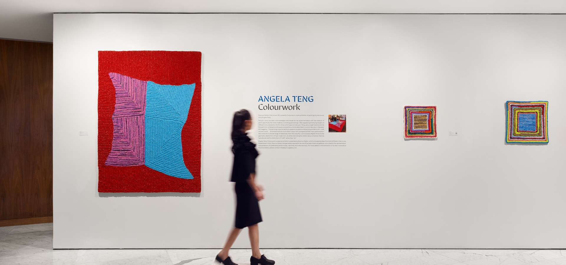 A girl looking at an art exhibition at Fairmont Pacific Rim