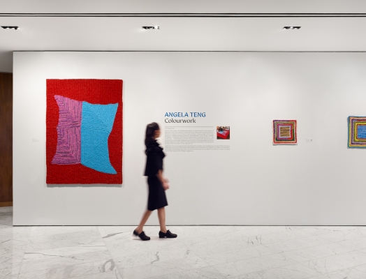 A girl looking at an art exhibition at Fairmont Pacific Rim
