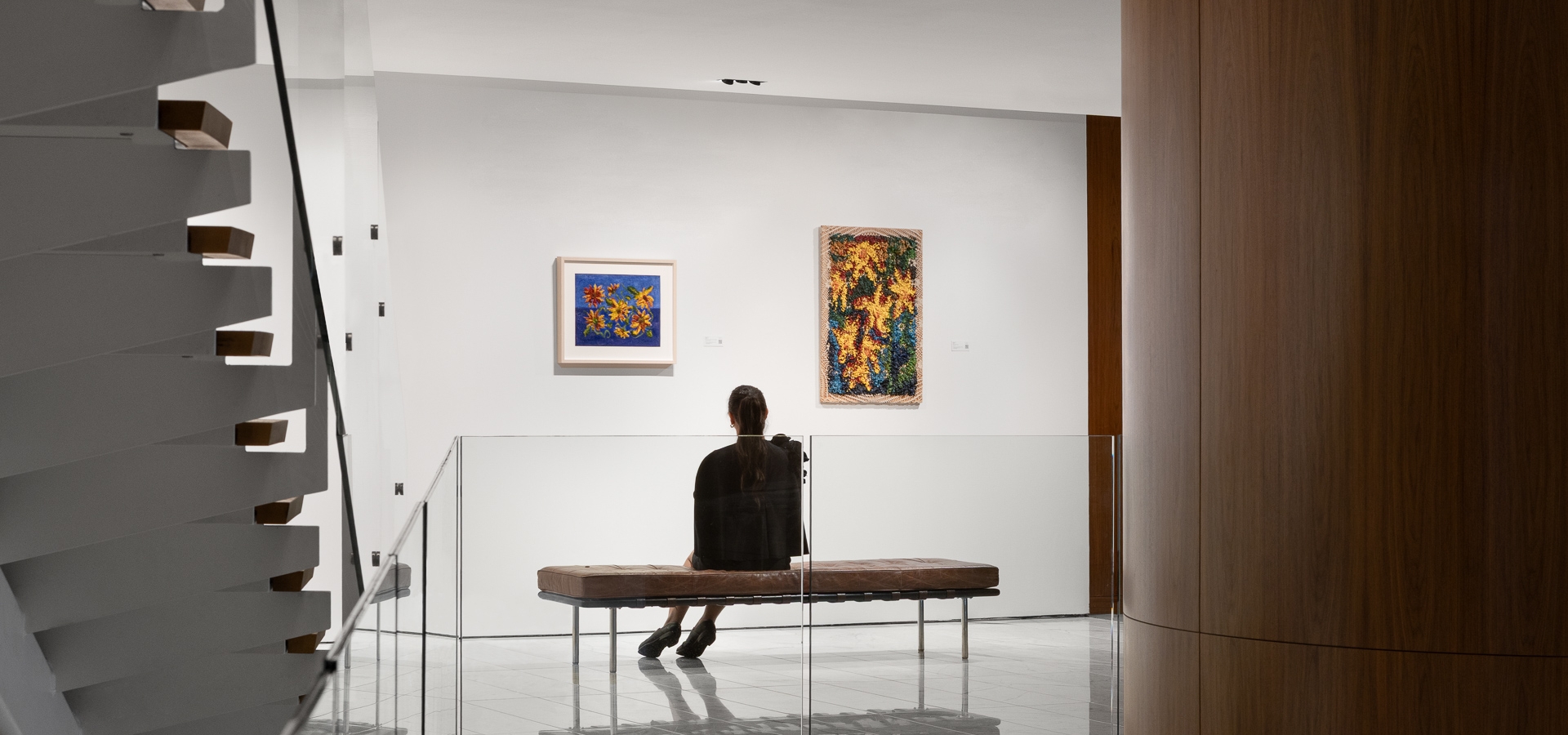 Girl looking at the artwork at Fairmont Pacific Rim Pacific Gallery