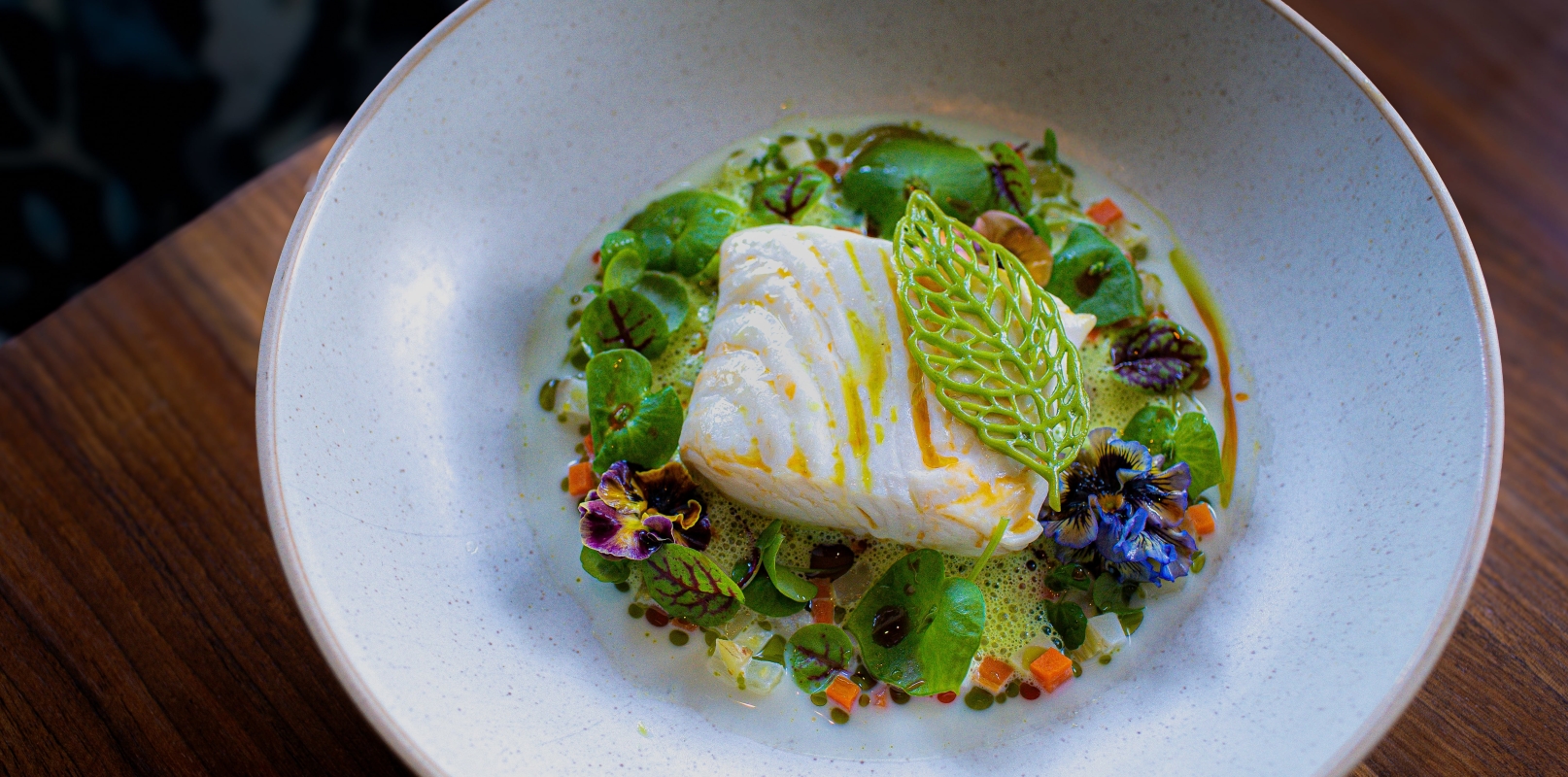 Close up of the halibut dish on the new spring menu at restaurant in Vancouver