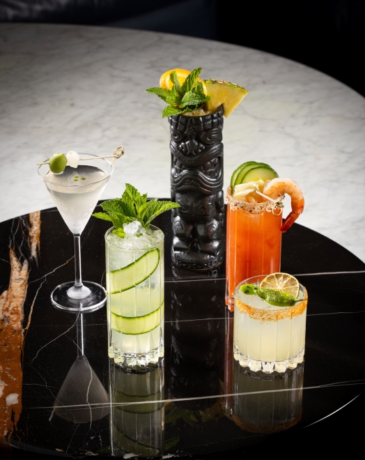 Four cocktails on a table