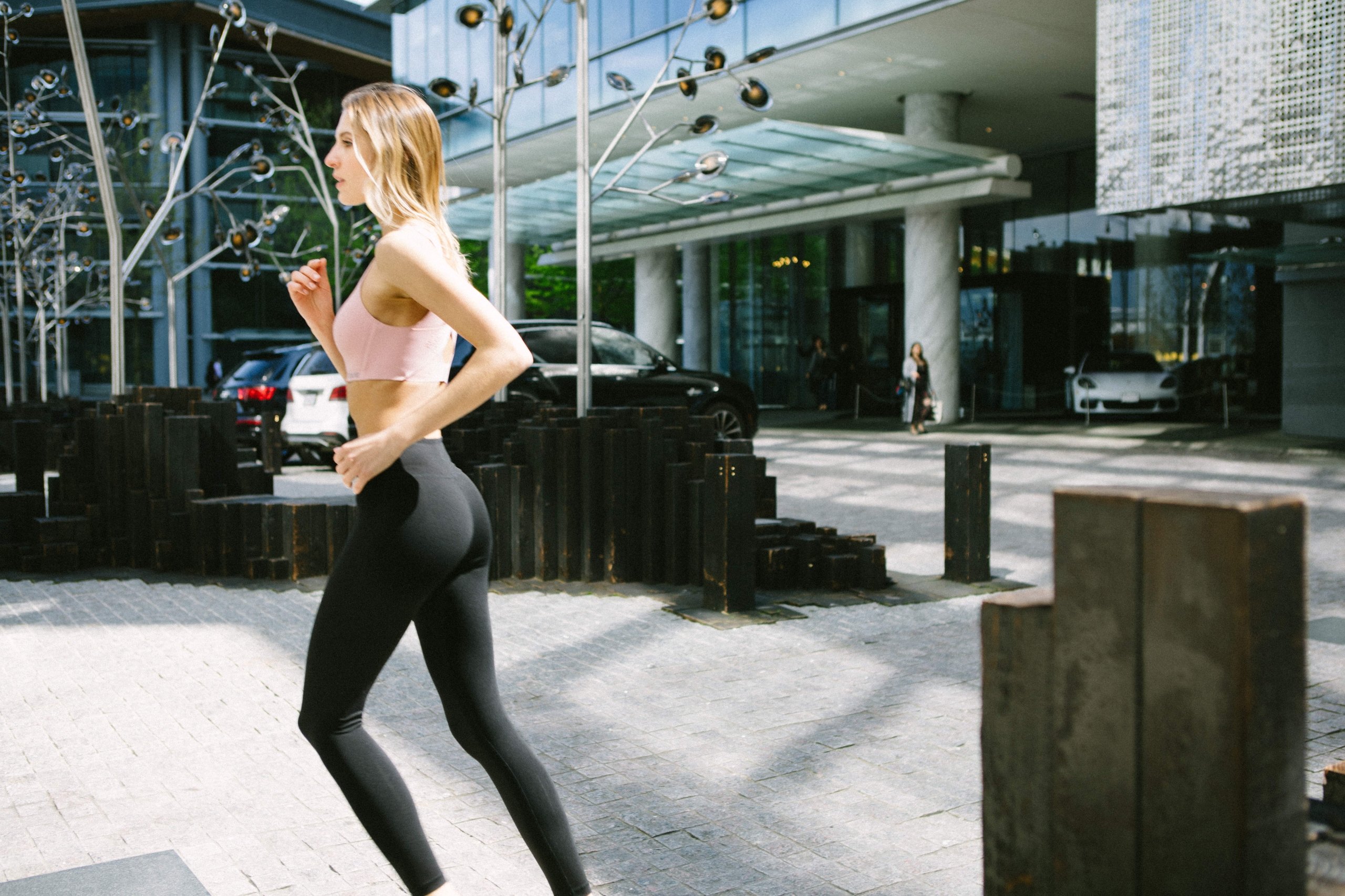 Woman working out at Fairmont Pacific Rim wit House Concepts