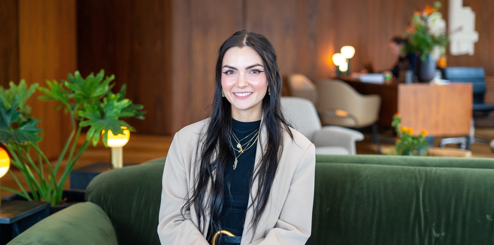 Girl sitting on couch in a lounge